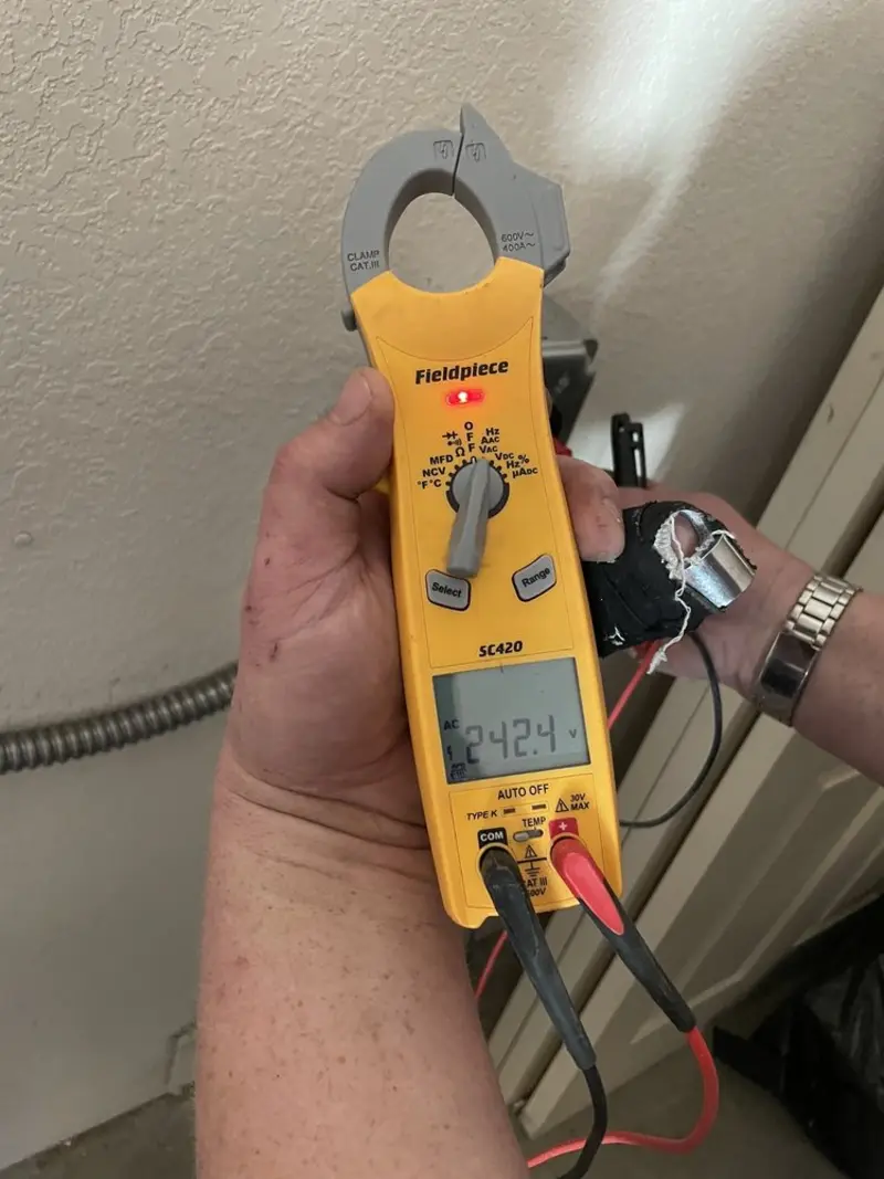 Voltage testing with clamp meter during Generator Installation in Coral Terrace